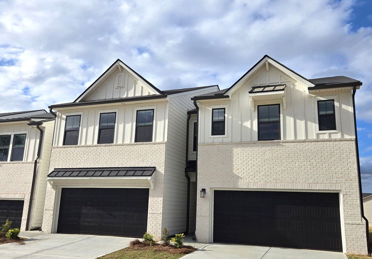 Front exterior of a new home in Azalea Square Townhomes, Lawrenceville, GA, highlighting curb appeal (Image 2).