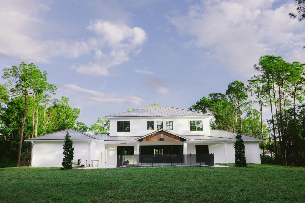 Front exterior of a new home in , Jupiter, FL, highlighting curb appeal (Image 2).