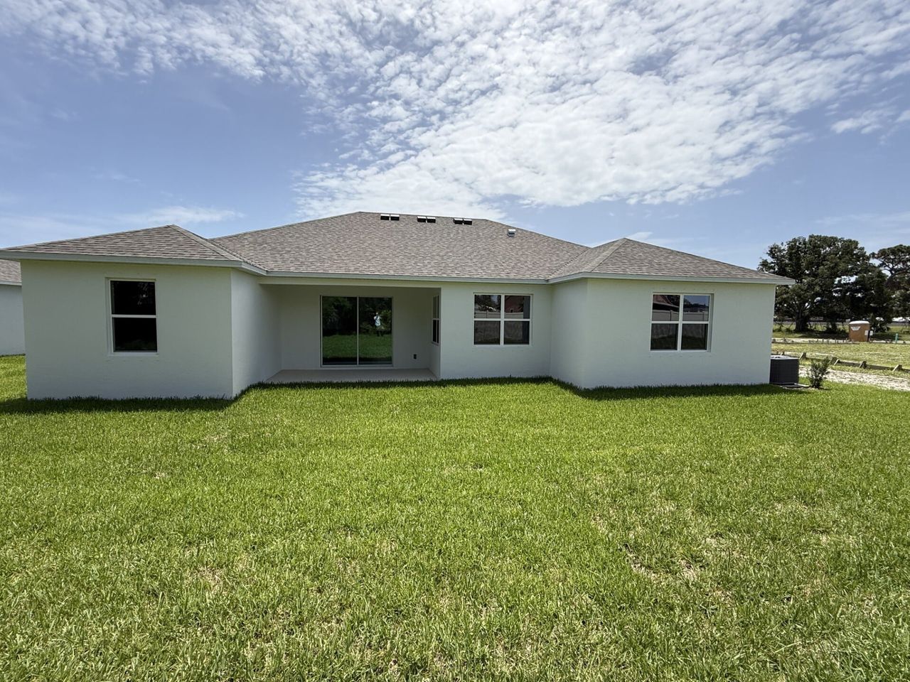 Exterior details and patio area of a home in Country Club Estates, Palm Bay (Image 2).