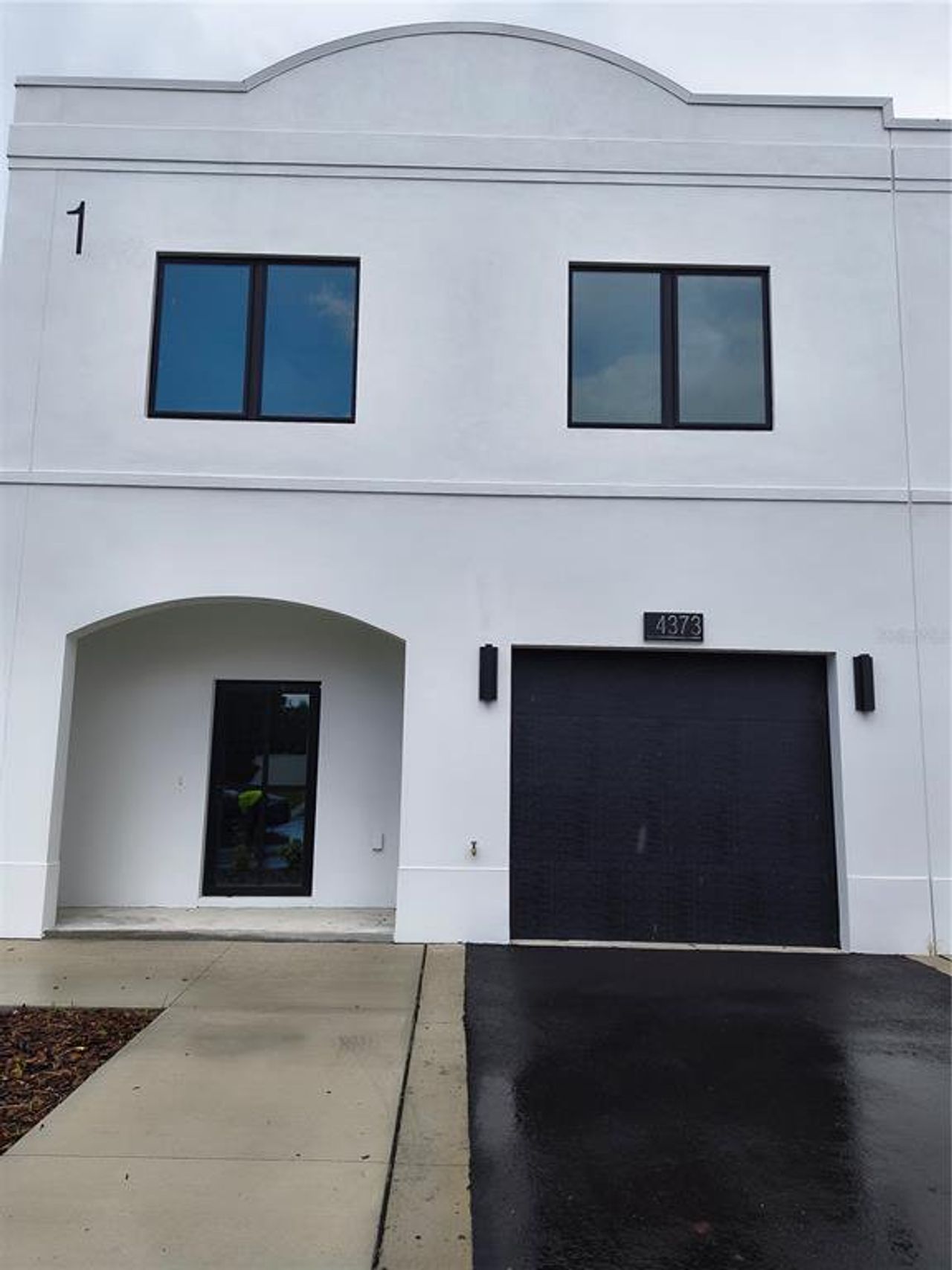Front exterior of a new home in , Tampa, FL, highlighting curb appeal (Image 2).