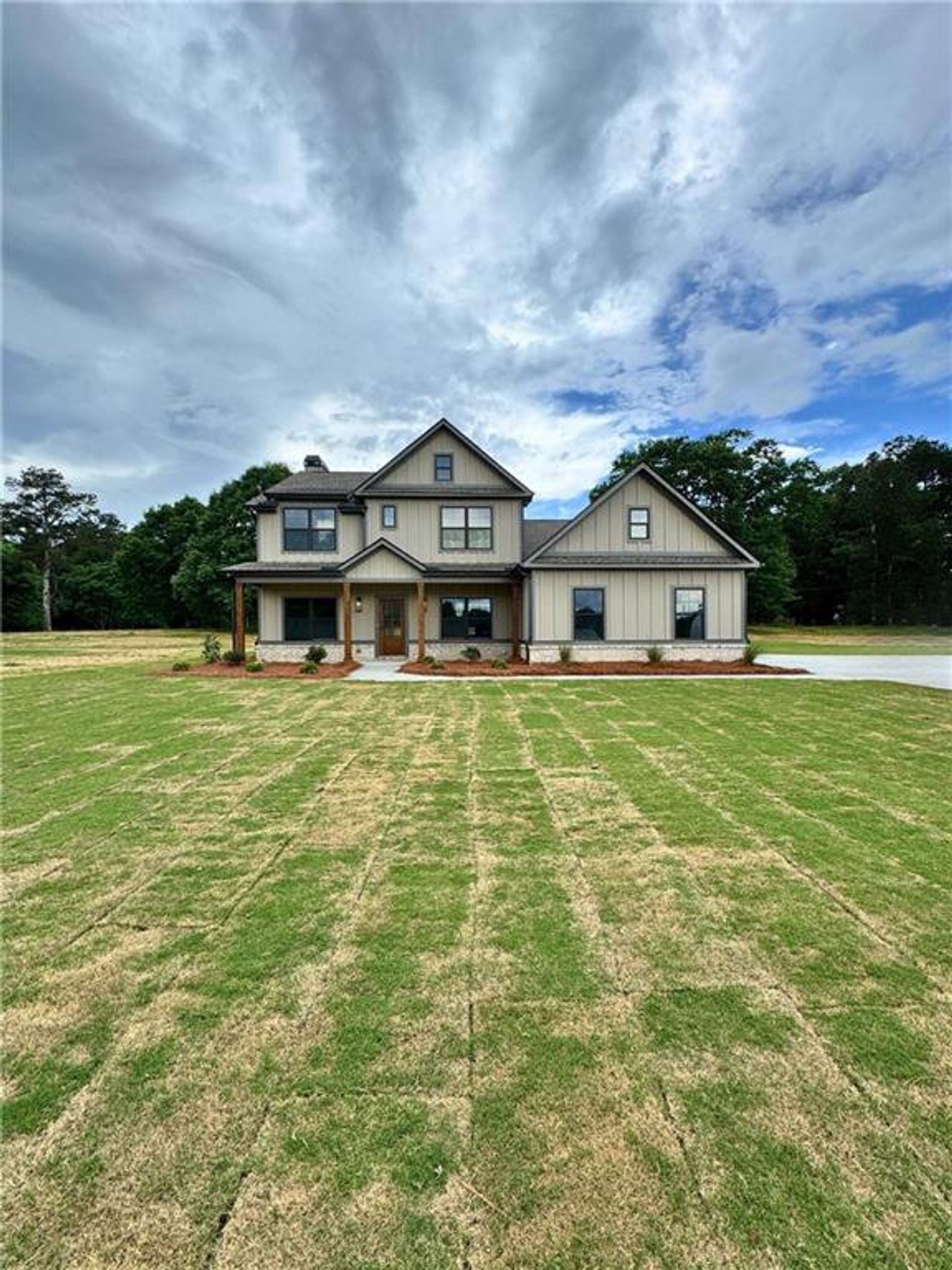 Front exterior of a new home in Youth Jersey Rd, Covington, GA, highlighting curb appeal (Image 2).