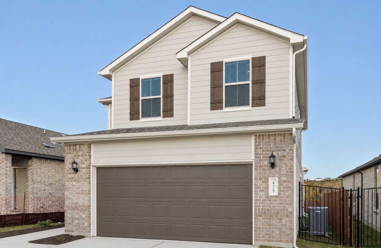 Front exterior of a new home in Saddleback at Santa Rita Ranch, Liberty Hill, TX, highlighting curb appeal (Image 2).