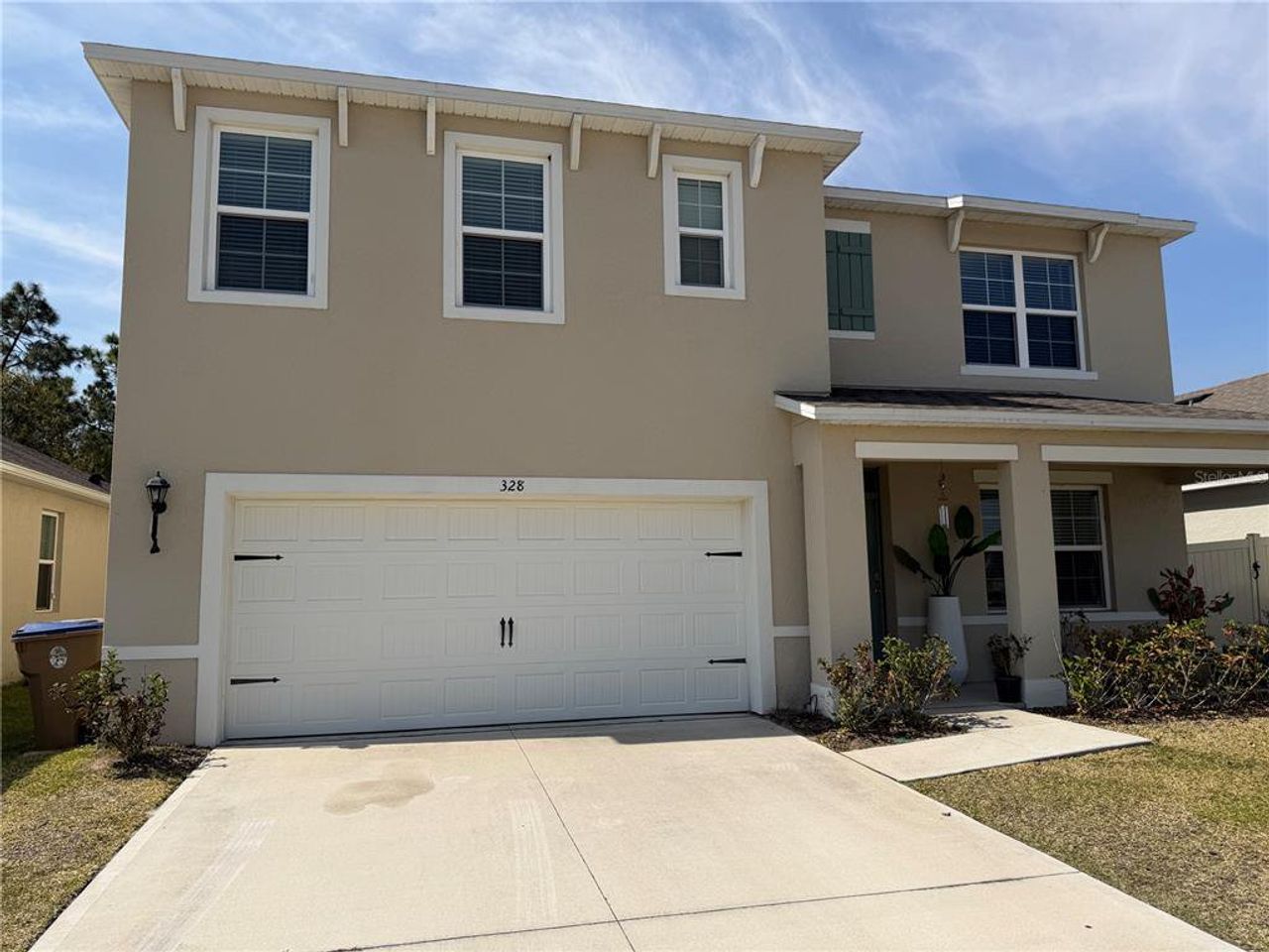 Front exterior of a new home in Preston Cove, St. Cloud, FL, highlighting curb appeal (Image 2). Front exterior of a new home in Preston Cove, St. Cloud, FL, highlighting curb appeal (Image 2).