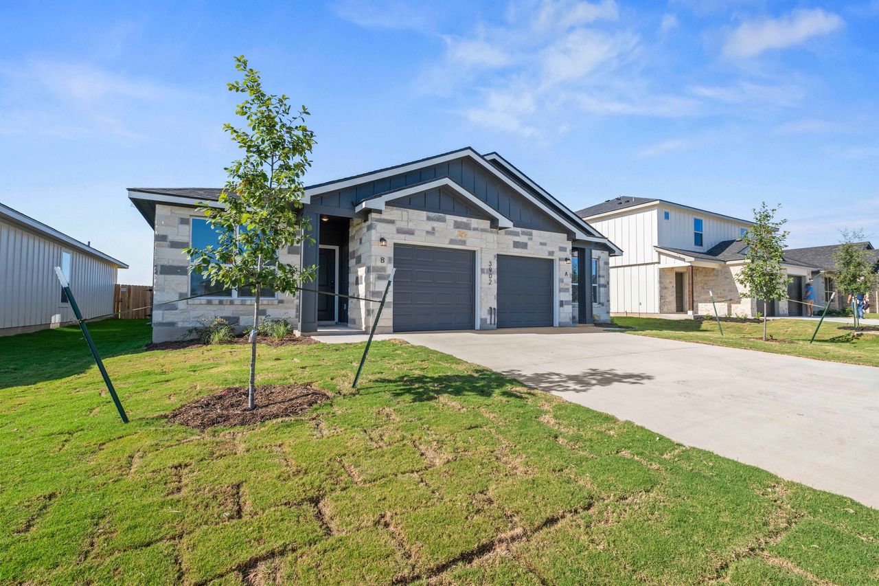 Front exterior of a new home in The Preserve at Thousand Oaks Duplexes, Killeen, TX, highlighting curb appeal (Image 2).