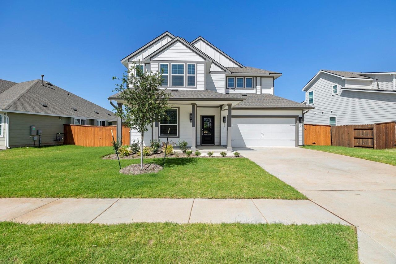 Front exterior of a new home in Orchard Ridge, Liberty Hill, TX, highlighting curb appeal (Image 2).