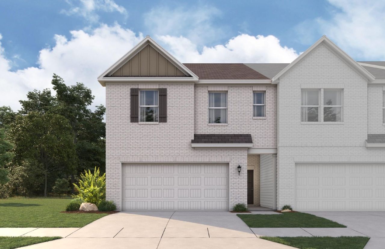 A white house with a garage.