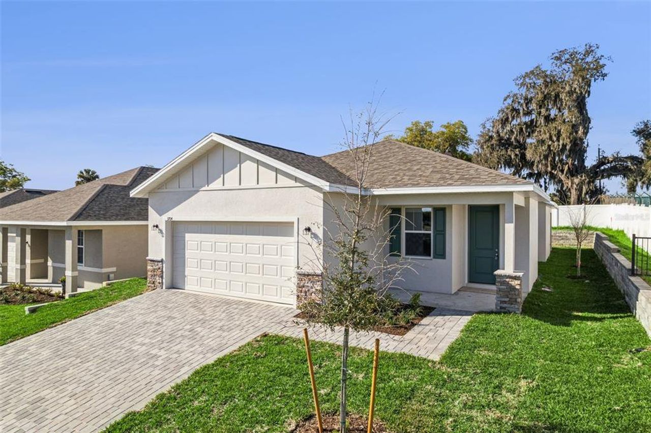 Front exterior of a new home in Grand Isle, Grand Island, FL, highlighting curb appeal (Image 2).