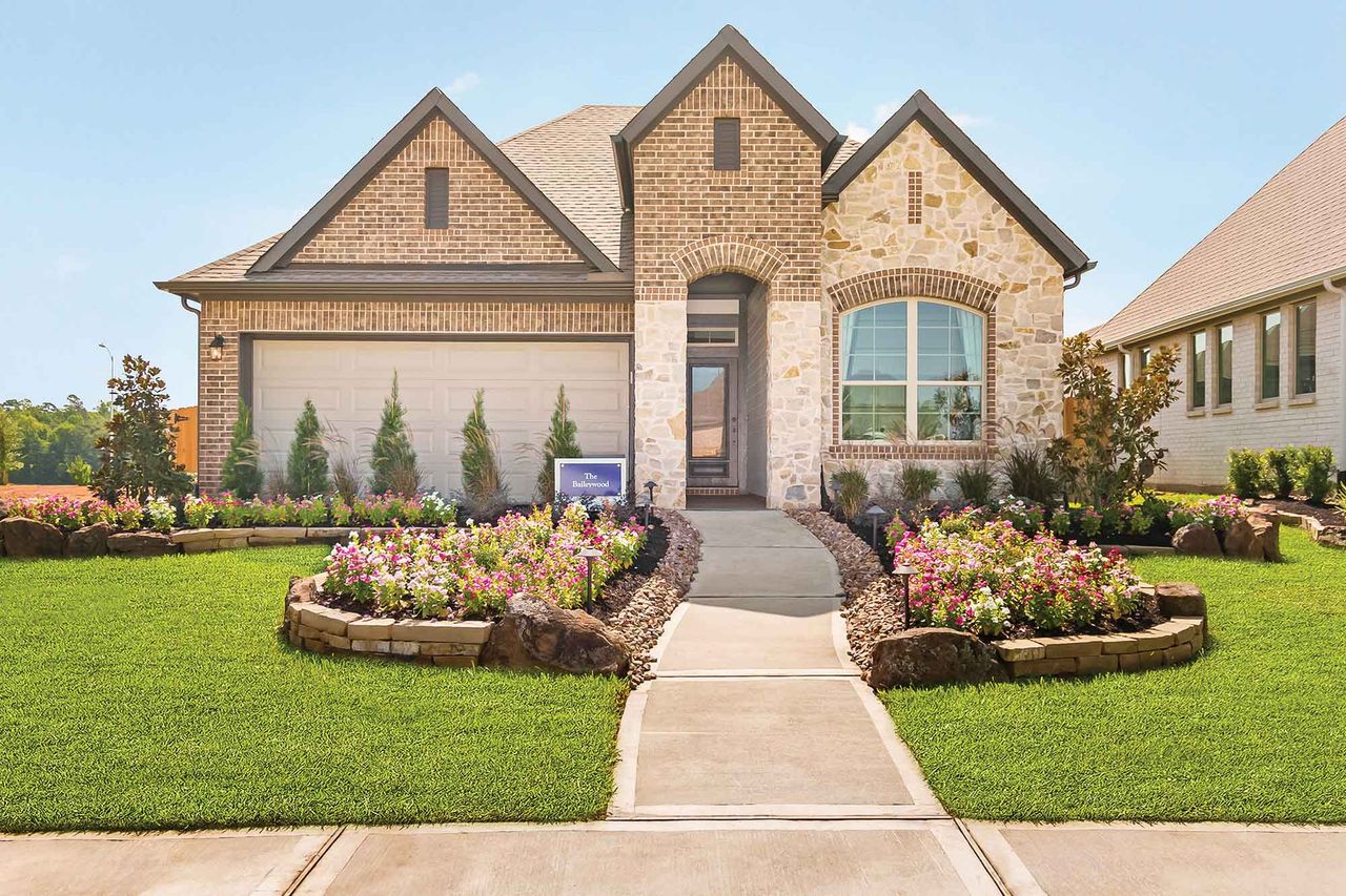 Representative exterior photo of a completed home built from the The Baileywood by David Weekley Homes in Jordan Ranch 45' Homesites, Fulshear, TX (Image 2). Representative exterior photo of a completed home built from the The Baileywood by David Weekley Homes in Jordan Ranch 45' Homesites, Fulshear, TX (Image 2).