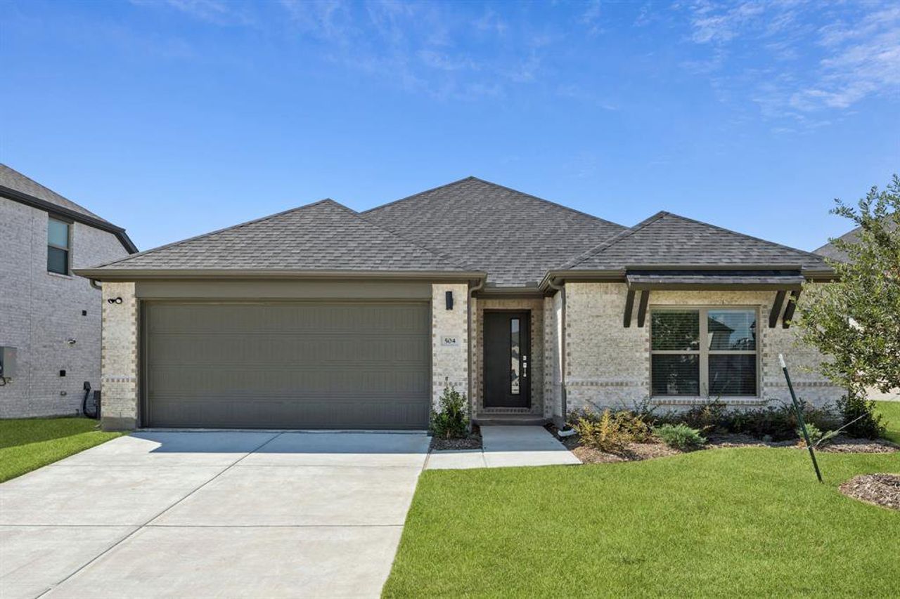 Front exterior of a new home in Devonshire, Forney, TX, highlighting curb appeal (Image 2). Front exterior of a new home in Devonshire, Forney, TX, highlighting curb appeal (Image 2).