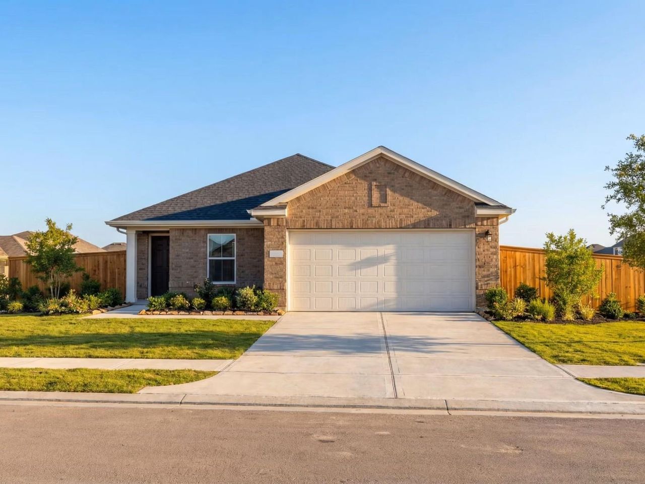 Front exterior of a new home in Emberly, Beasley, TX, highlighting curb appeal (Image 2).