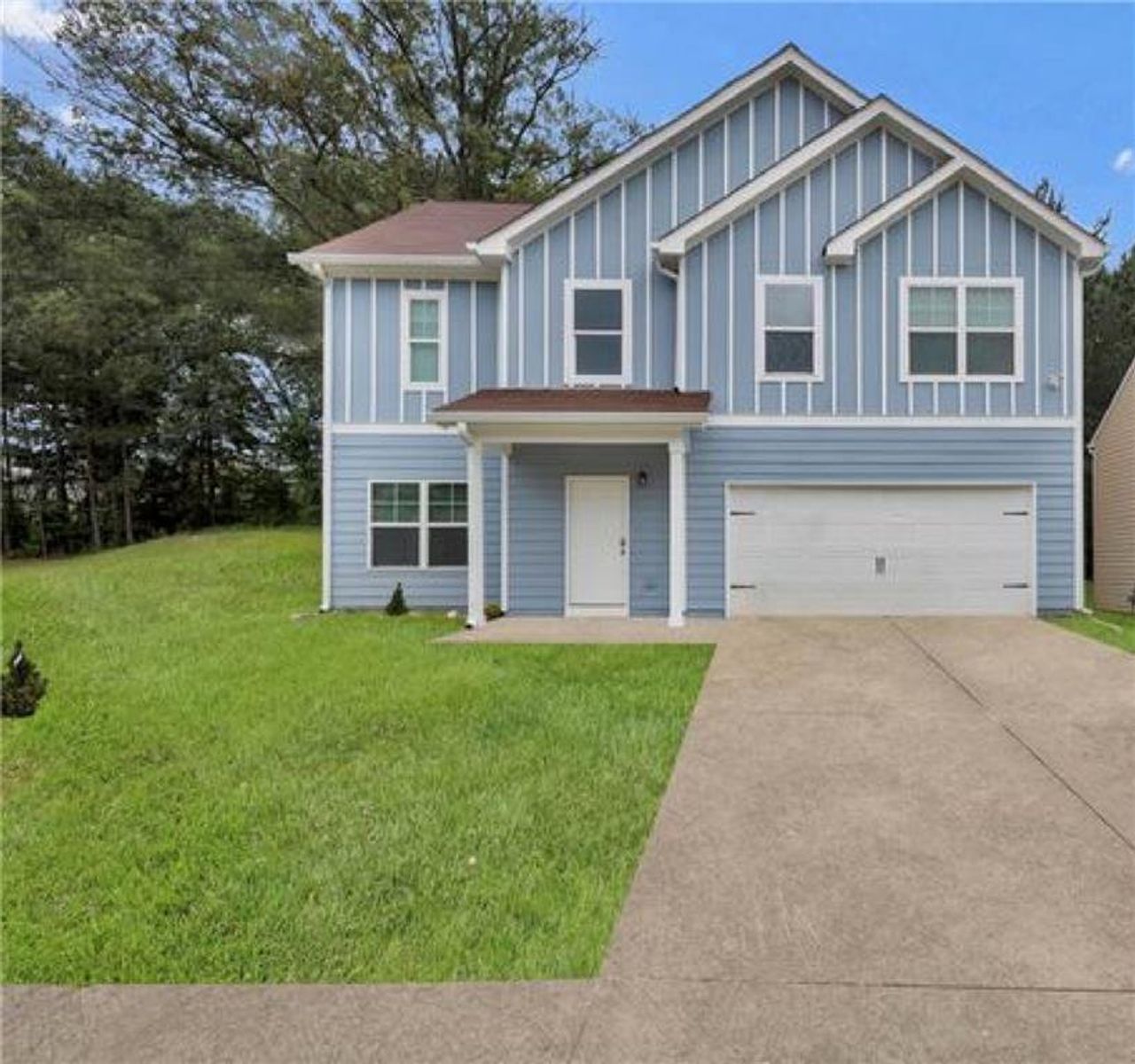 Front exterior of a new home in , Union City, GA, highlighting curb appeal (Image 2).
