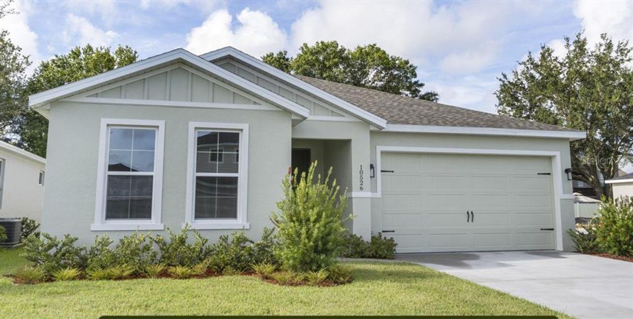 Front exterior of a new home in Estes Reserve, Eustis, FL, highlighting curb appeal (Image 2).