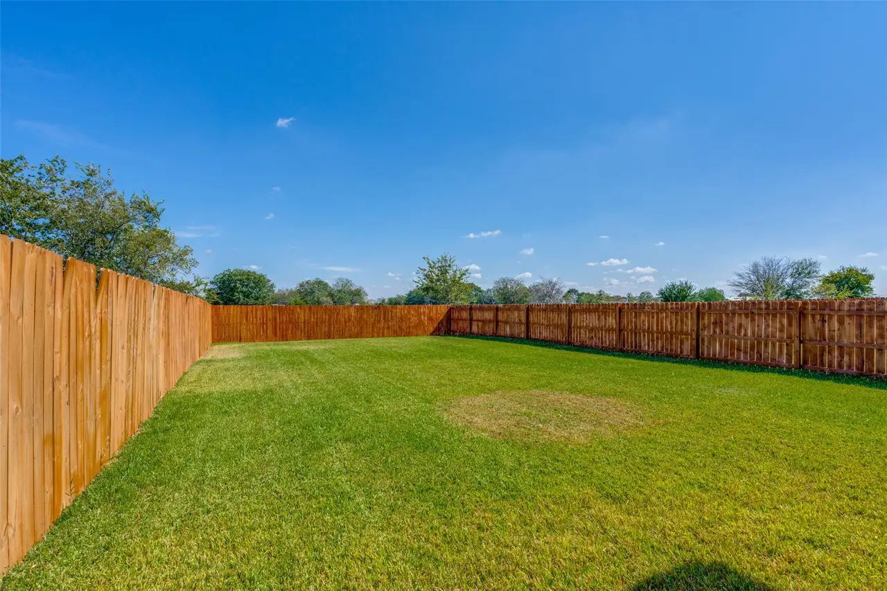 View of fenced backyard