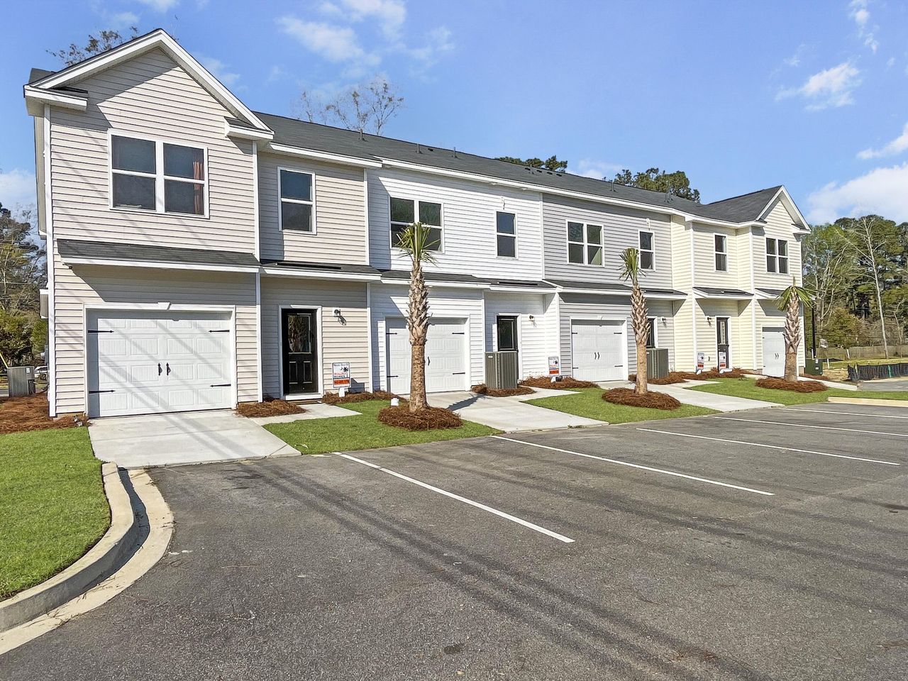 Front exterior of a new home in Garbon Townhomes, Summerville, SC, highlighting curb appeal (Image 2). Front exterior of a new home in Garbon Townhomes, Summerville, SC, highlighting curb appeal (Image 2).