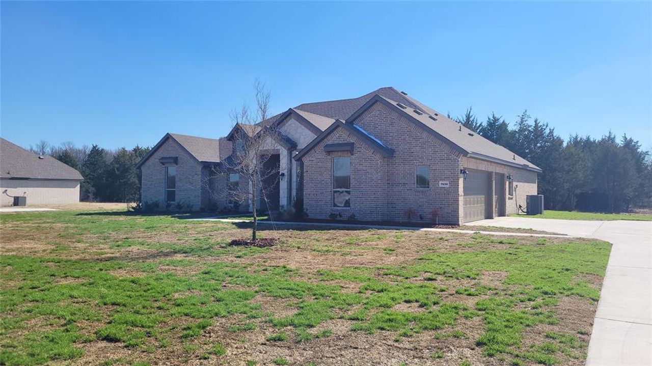 Front exterior of a new home in , Midlothian, TX, highlighting curb appeal (Image 2).
