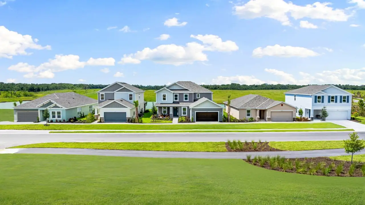 Front exterior of a new home in Firethorn, Parrish, FL, highlighting curb appeal (Image 2). Front exterior of a new home in Firethorn, Parrish, FL, highlighting curb appeal (Image 2).