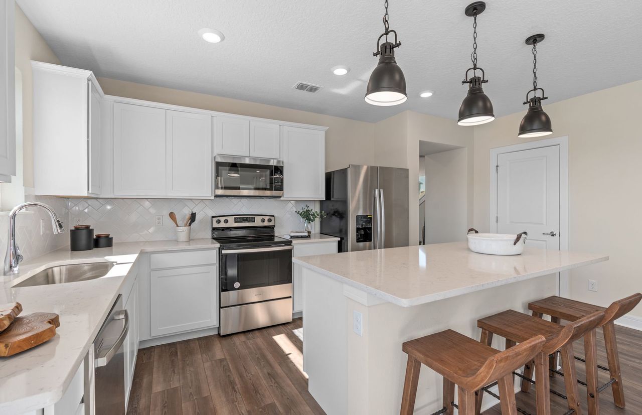 Furnished interior view inside a new home in EverBe, Orlando (Image 2).