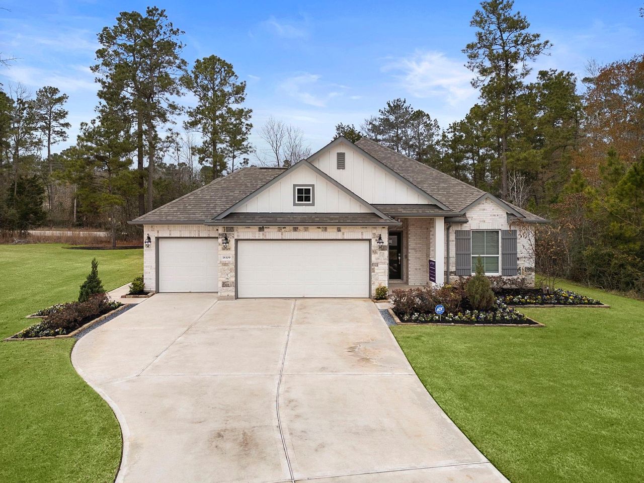 Front exterior of a new home in Oakwood Ranch, Willis, TX, highlighting curb appeal (Image 2). Front exterior of a new home in Oakwood Ranch, Willis, TX, highlighting curb appeal (Image 2).