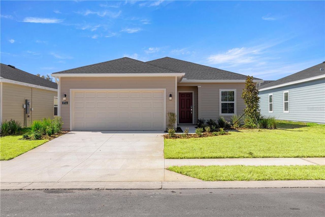 Front exterior of a new home in Pioneer Ranch, Ocala, FL, highlighting curb appeal (Image 2).