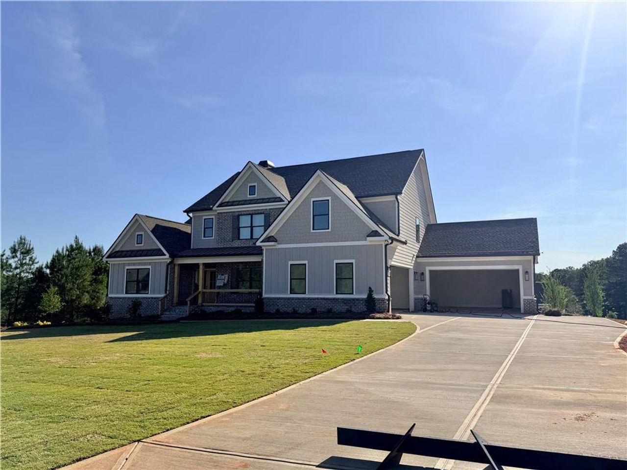 Front exterior of a new home in Stonegate, Monroe, GA, highlighting curb appeal (Image 2).