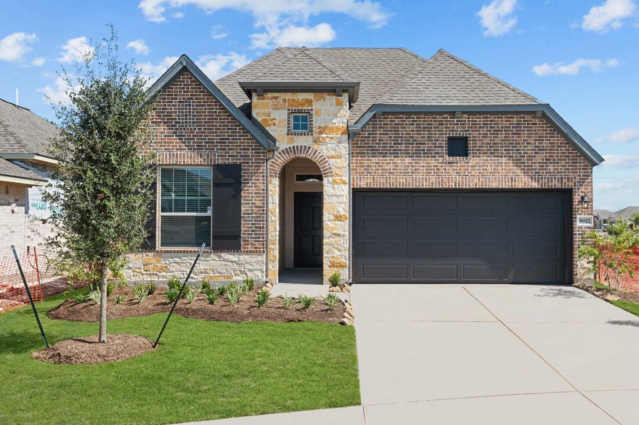 Representative exterior photo of a completed home built from the The Penmark by David Weekley Homes in Jordan Ranch 45' Homesites, Fulshear, TX (Image 2).