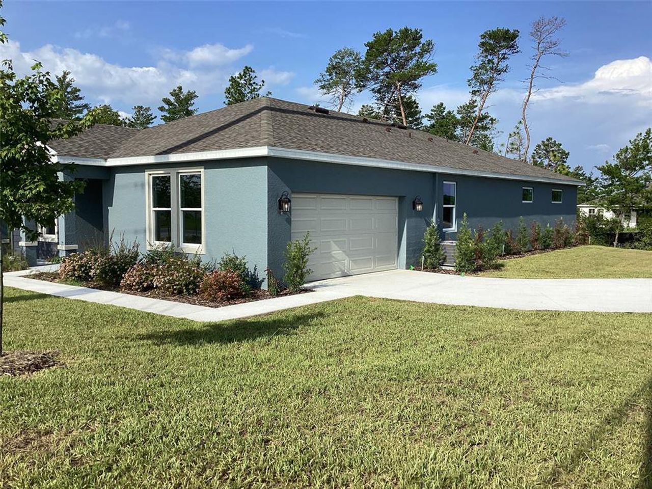 Front exterior of a new home in , Ocala, FL, highlighting curb appeal (Image 2).
