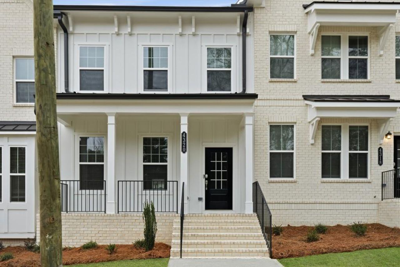 Exterior details and patio area of a home in Towns at Creekside, Doraville (Image 2).