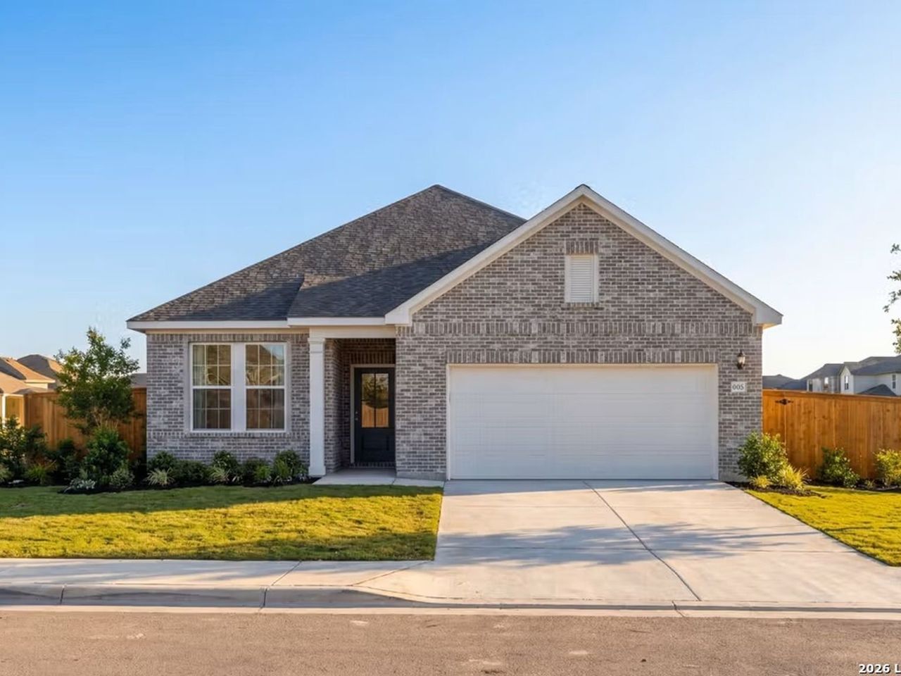 Front exterior of a new home in Hickory Ridge, Elmendorf, TX, highlighting curb appeal (Image 2).