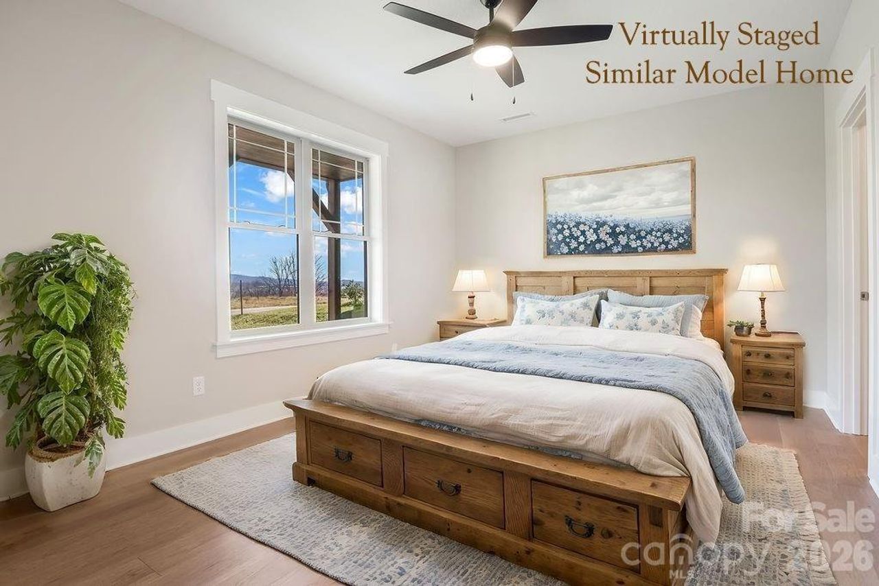 Upper level living area offers flexible space with private, wooded views