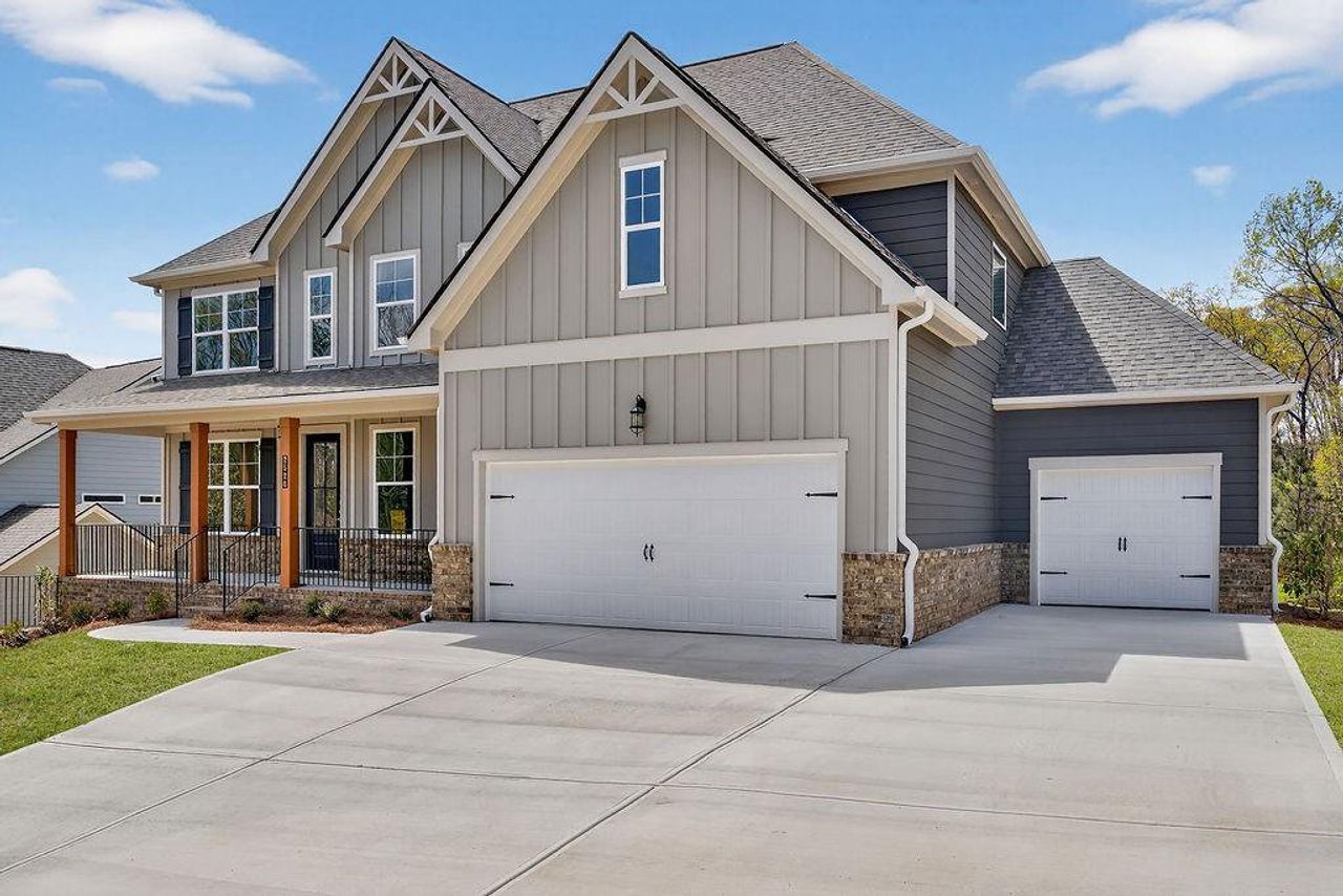 Front exterior of a new home in The Manor at Gainesville Township, Gainesville, GA, highlighting curb appeal (Image 2). Front exterior of a new home in The Manor at Gainesville Township, Gainesville, GA, highlighting curb appeal (Image 2).