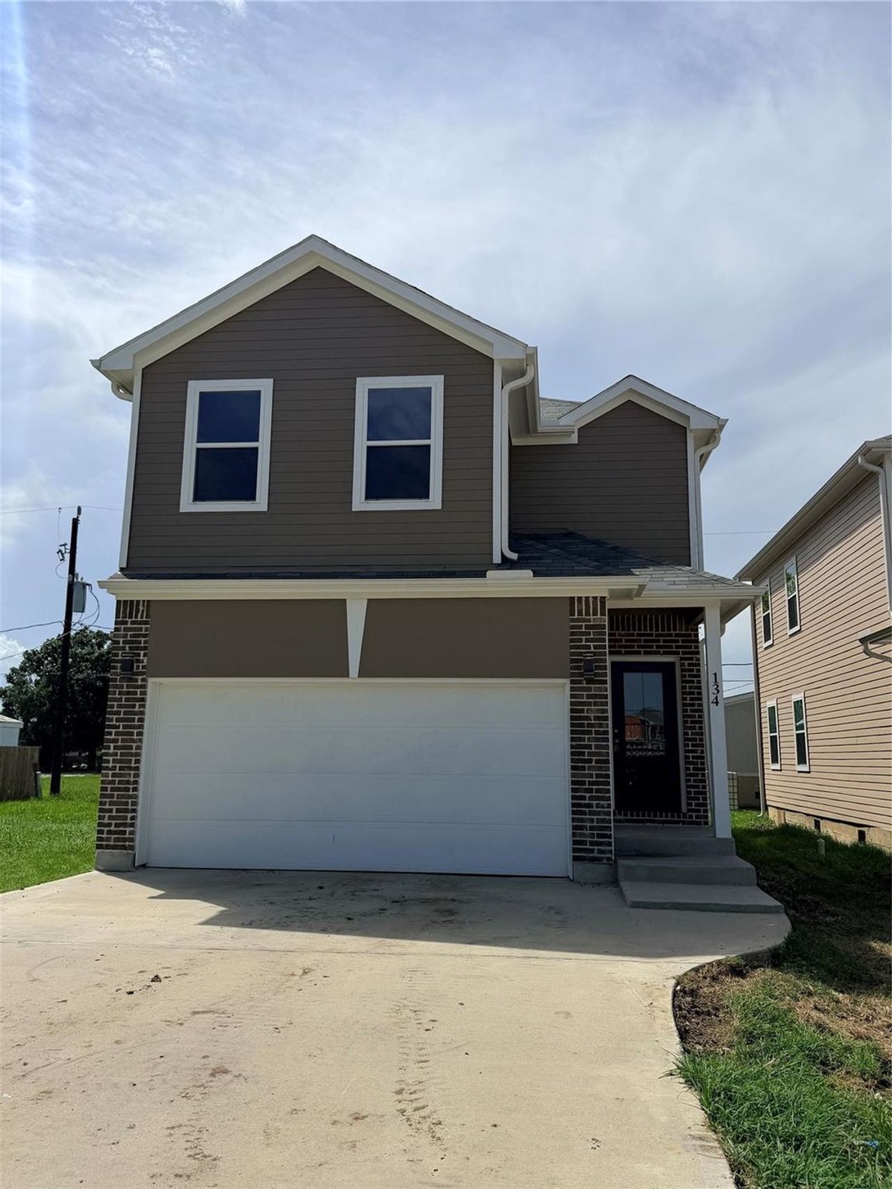 Front exterior of a new home in , Baytown, TX, highlighting curb appeal (Image 2).