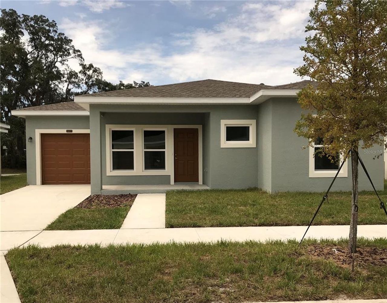 Front exterior of a new home in , Tampa, FL, highlighting curb appeal (Image 2).