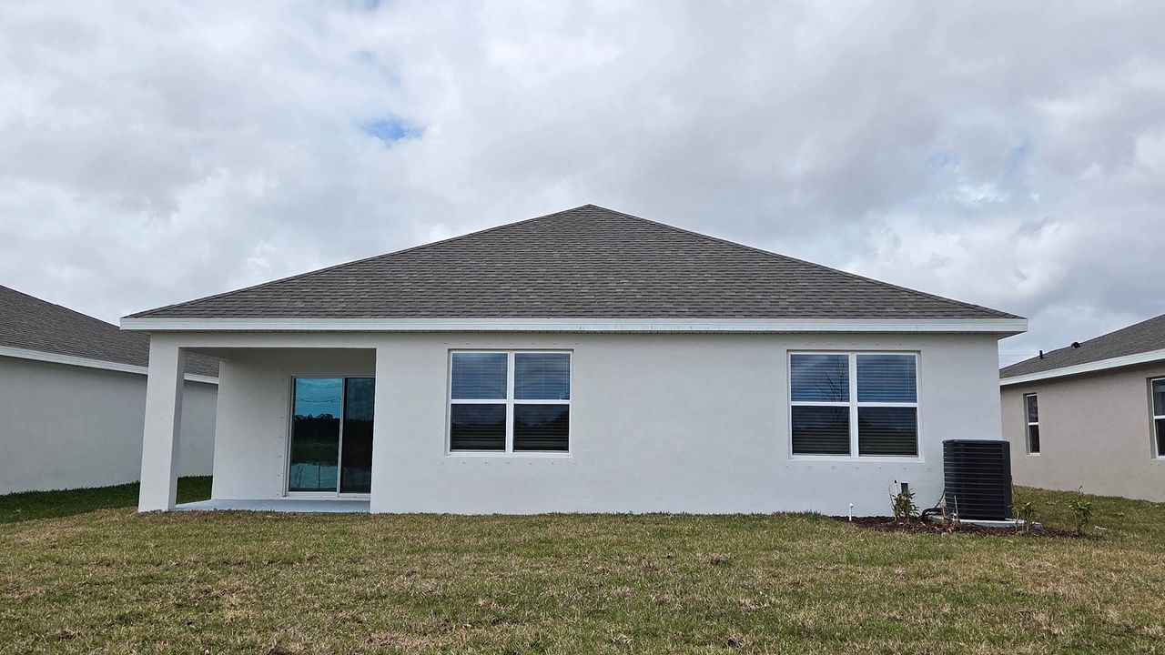 Exterior details and patio area of a home in Venetian Grove, Vero Beach (Image 2).