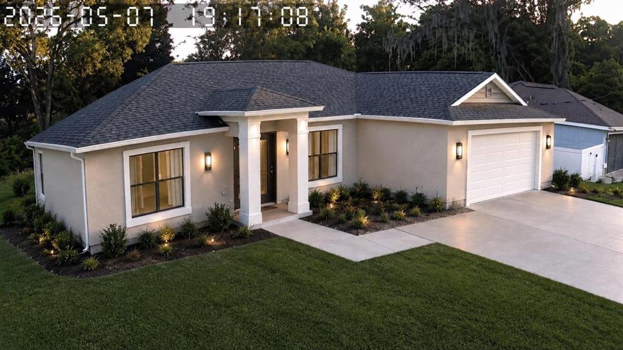 Front exterior of a new home in , Summerfield, FL, highlighting curb appeal (Image 2).