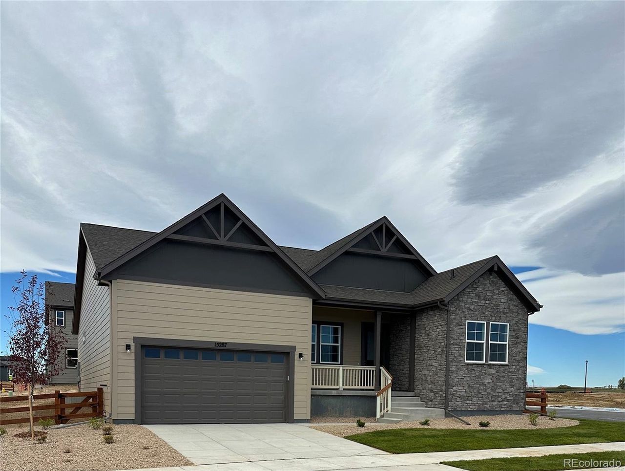 Front exterior of a new home in The Estates Collection at Talon Pointe, Thornton, CO, highlighting curb appeal (Image 2).