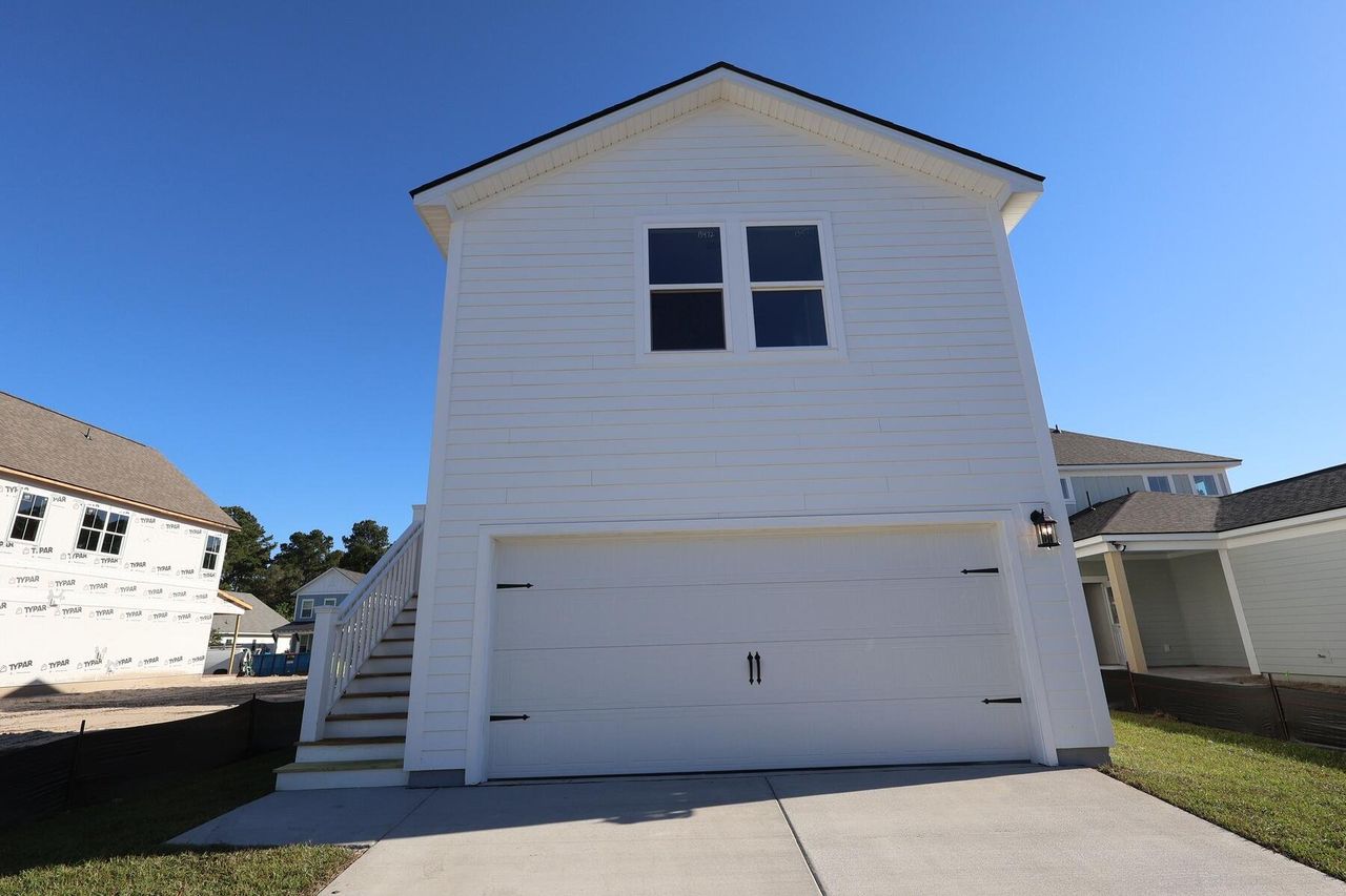 Front exterior of a new home in , Charleston, SC, highlighting curb appeal (Image 2). Front exterior of a new home in , Charleston, SC, highlighting curb appeal (Image 2).