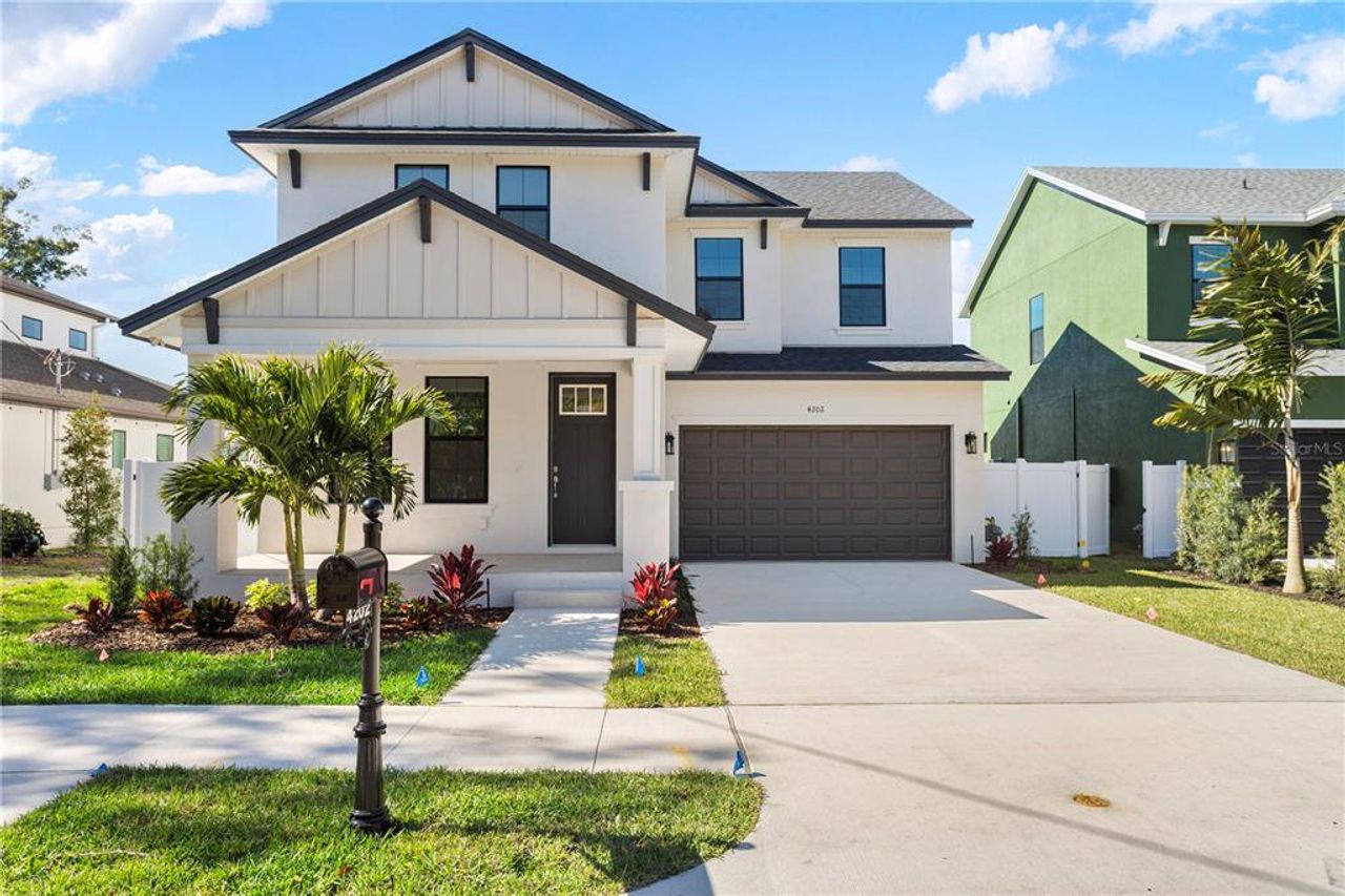 Front exterior of a new home in Clearfield Crossings, Tampa, FL, highlighting curb appeal (Image 2). Front exterior of a new home in Clearfield Crossings, Tampa, FL, highlighting curb appeal (Image 2).