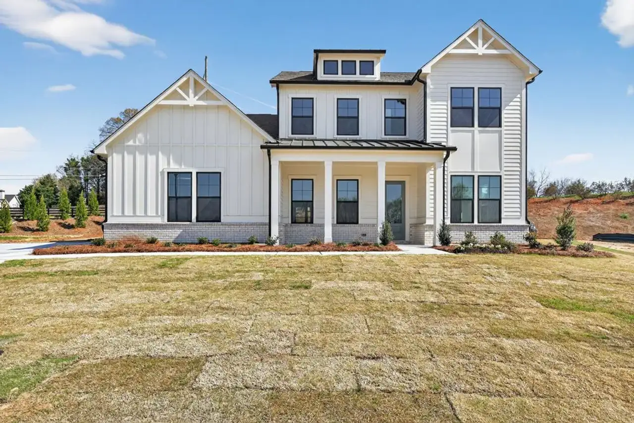 Front exterior of a new home in Wayt Farm, Cumming, GA, highlighting curb appeal (Image 2).