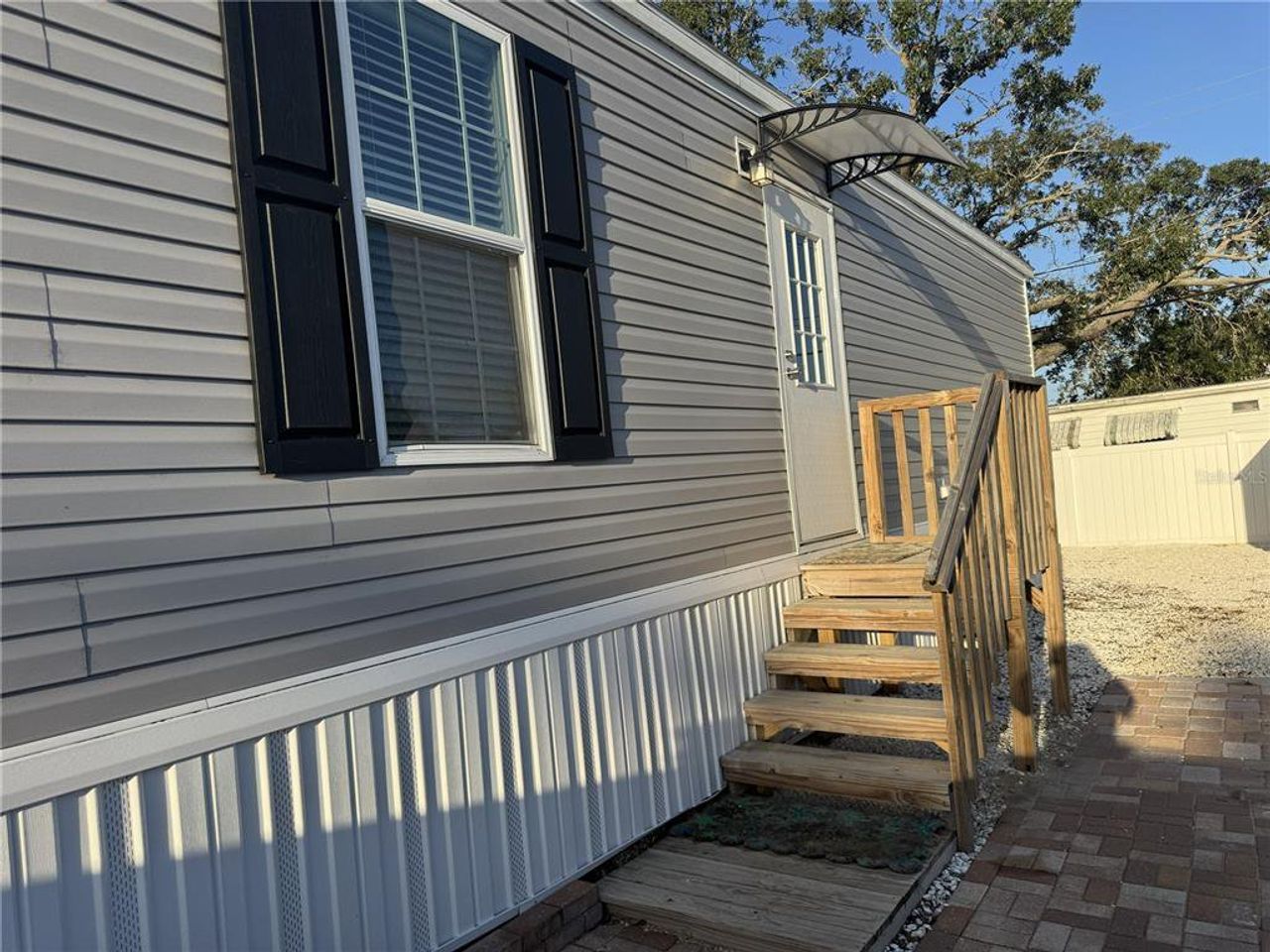 Exterior details and patio area of a home in , Holiday (Image 2). Exterior details and patio area of a home in , Holiday (Image 2).