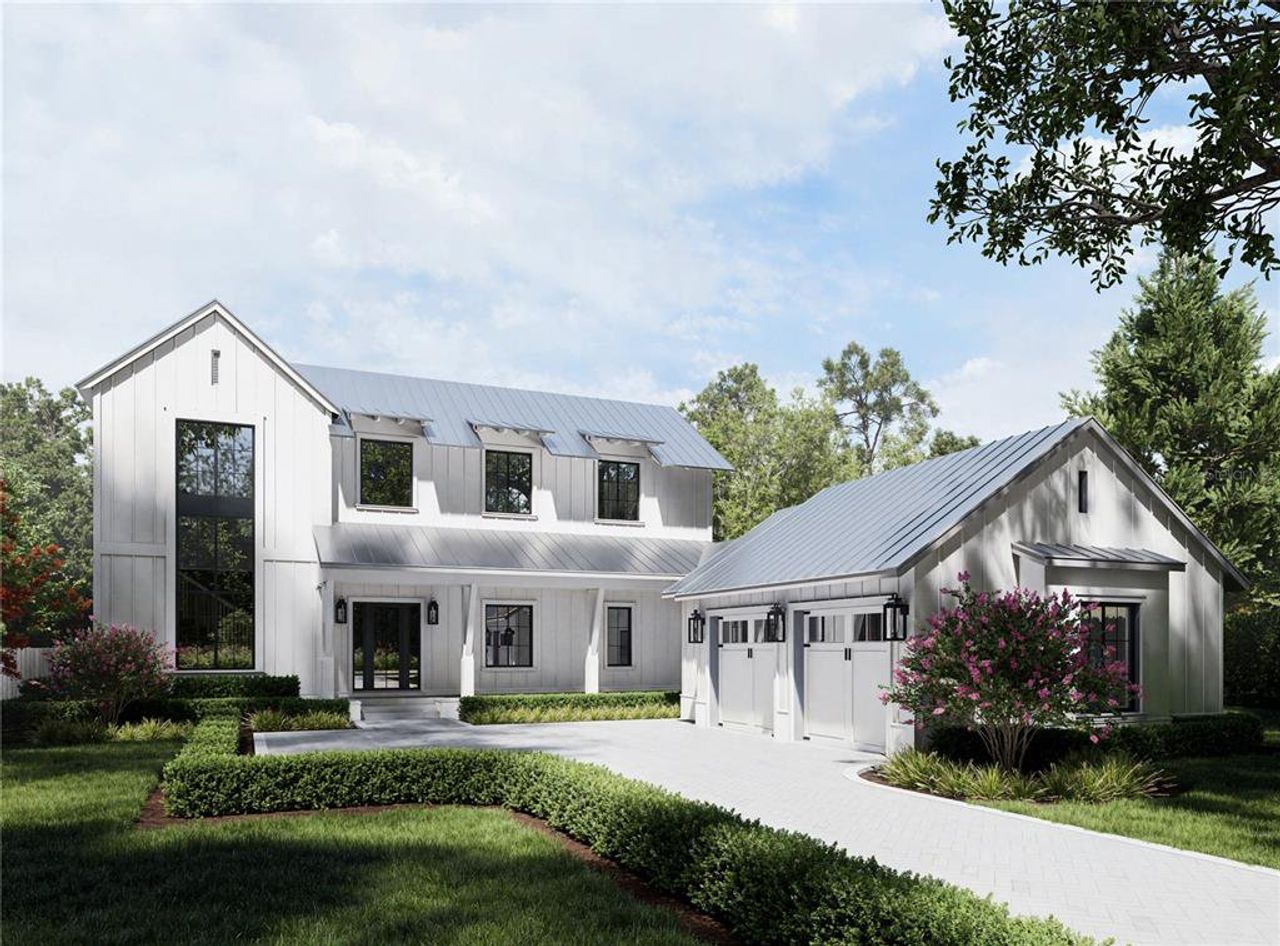 Front exterior of a new home in The Grove, Oakland, FL, highlighting curb appeal (Image 2).