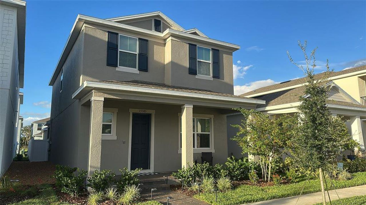 Front exterior of a new home in , Winter Garden, FL, highlighting curb appeal (Image 2).