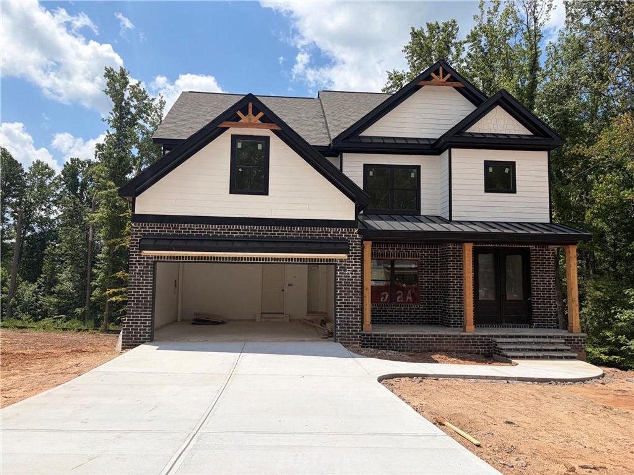 Front exterior of a new home in , Cumming, GA, highlighting curb appeal (Image 2). Front exterior of a new home in , Cumming, GA, highlighting curb appeal (Image 2).