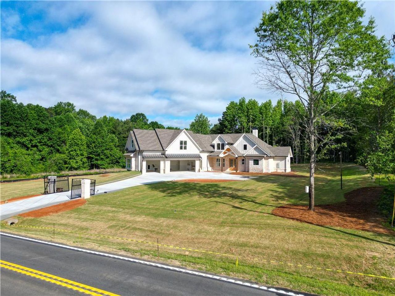 Front exterior of a new home in , Loganville, GA, highlighting curb appeal (Image 2).