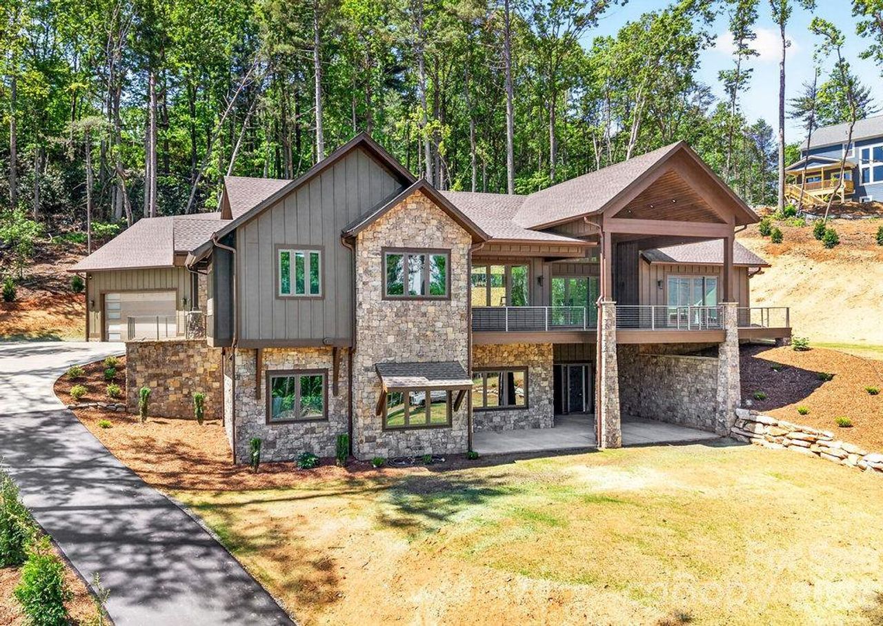 Front exterior of a new home in , Hendersonville, NC, highlighting curb appeal (Image 2). Front exterior of a new home in , Hendersonville, NC, highlighting curb appeal (Image 2).