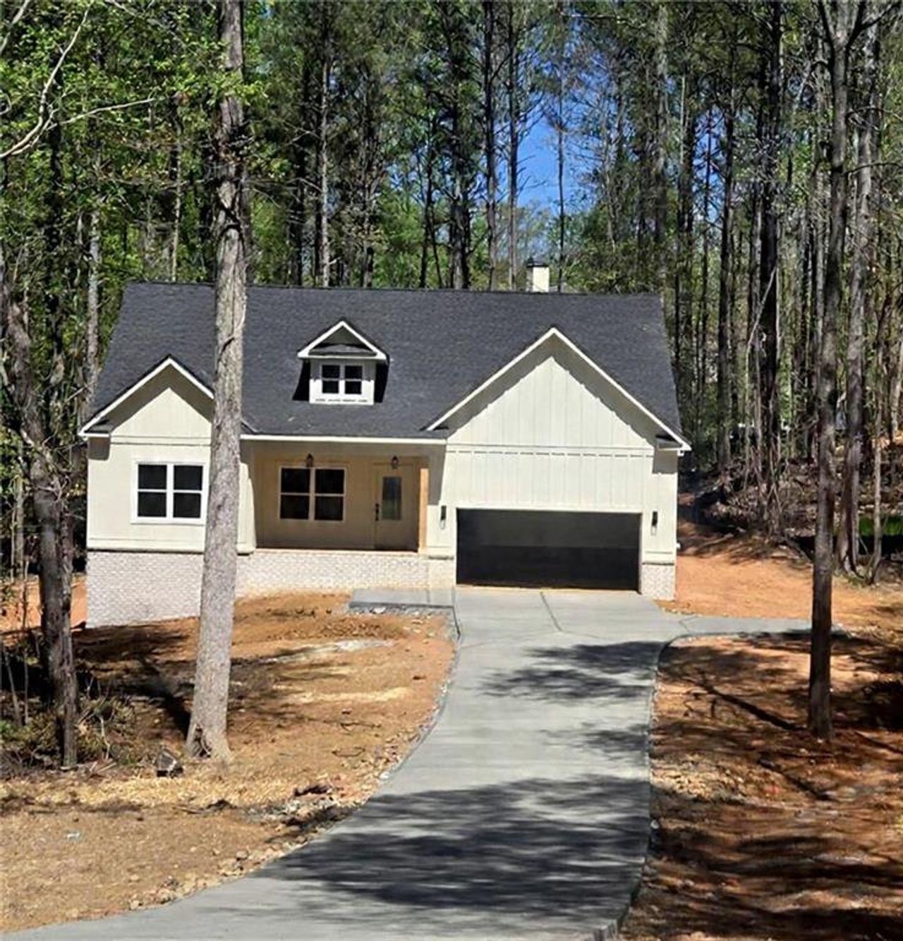 Front exterior of a new home in Autumn Brook, Canton, GA, highlighting curb appeal (Image 2). Front exterior of a new home in Autumn Brook, Canton, GA, highlighting curb appeal (Image 2).