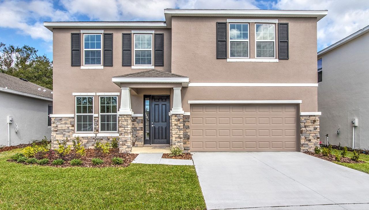 Representative exterior photo of a completed home built from the Holden by D.R. Horton in Waterford, Brooksville, FL (Image 2). Representative exterior photo of a completed home built from the Holden by D.R. Horton in Waterford, Brooksville, FL (Image 2).