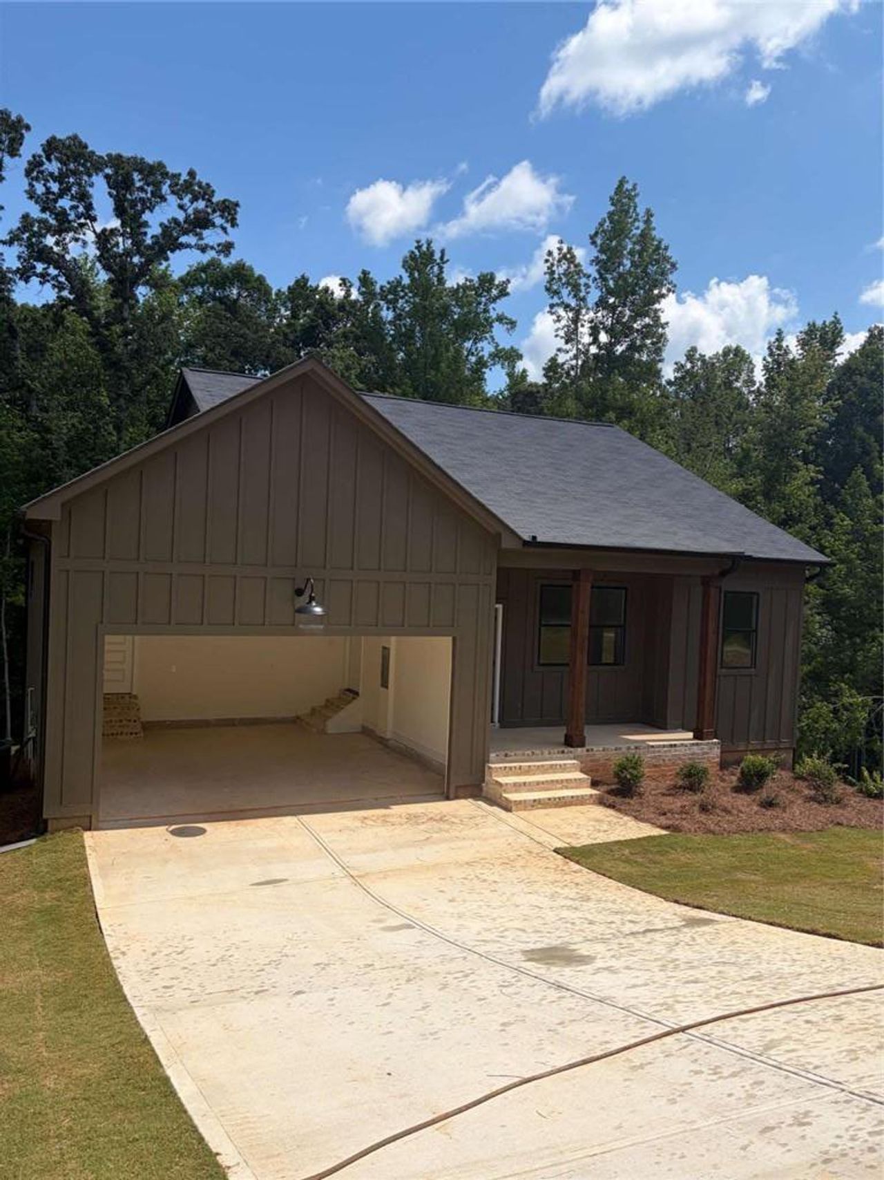 Front exterior of a new home in , Buchanan, GA, highlighting curb appeal (Image 2).
