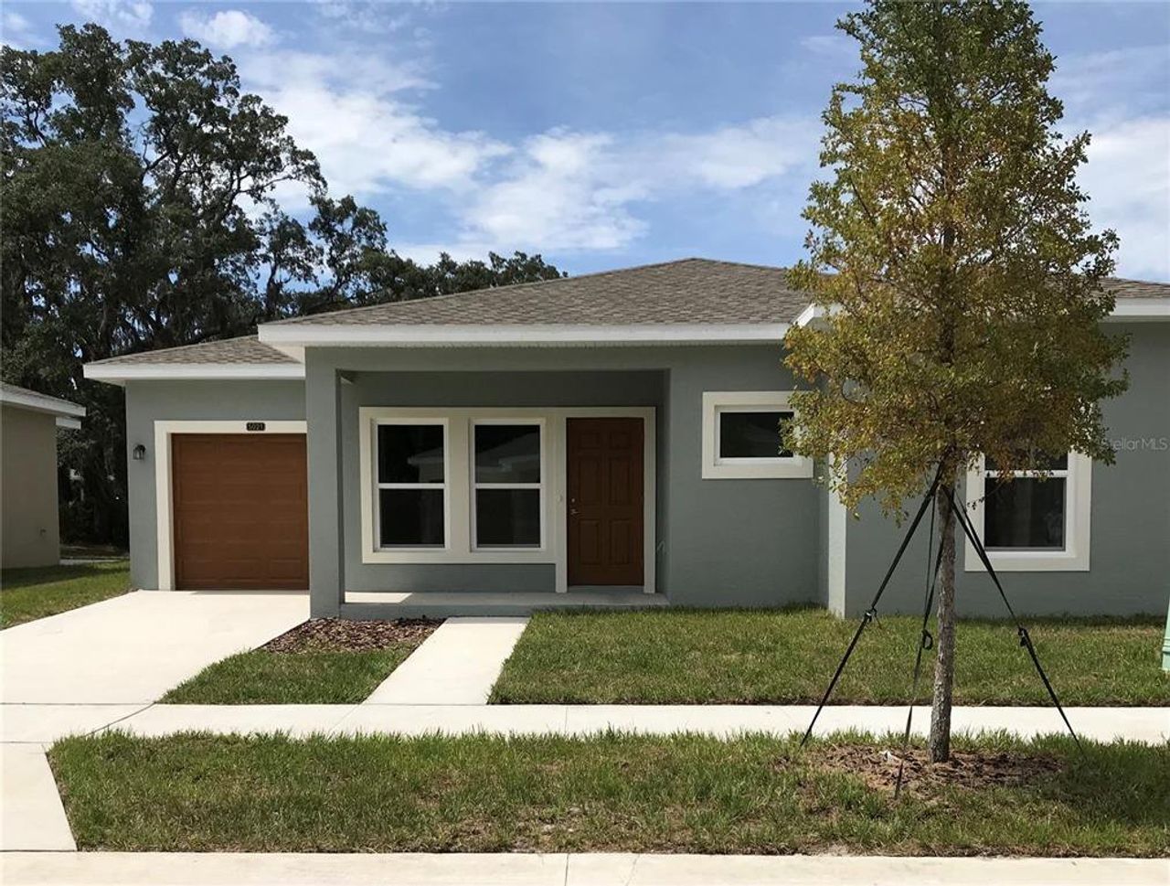 Front exterior of a new home in , Tampa, FL, highlighting curb appeal (Image 2).