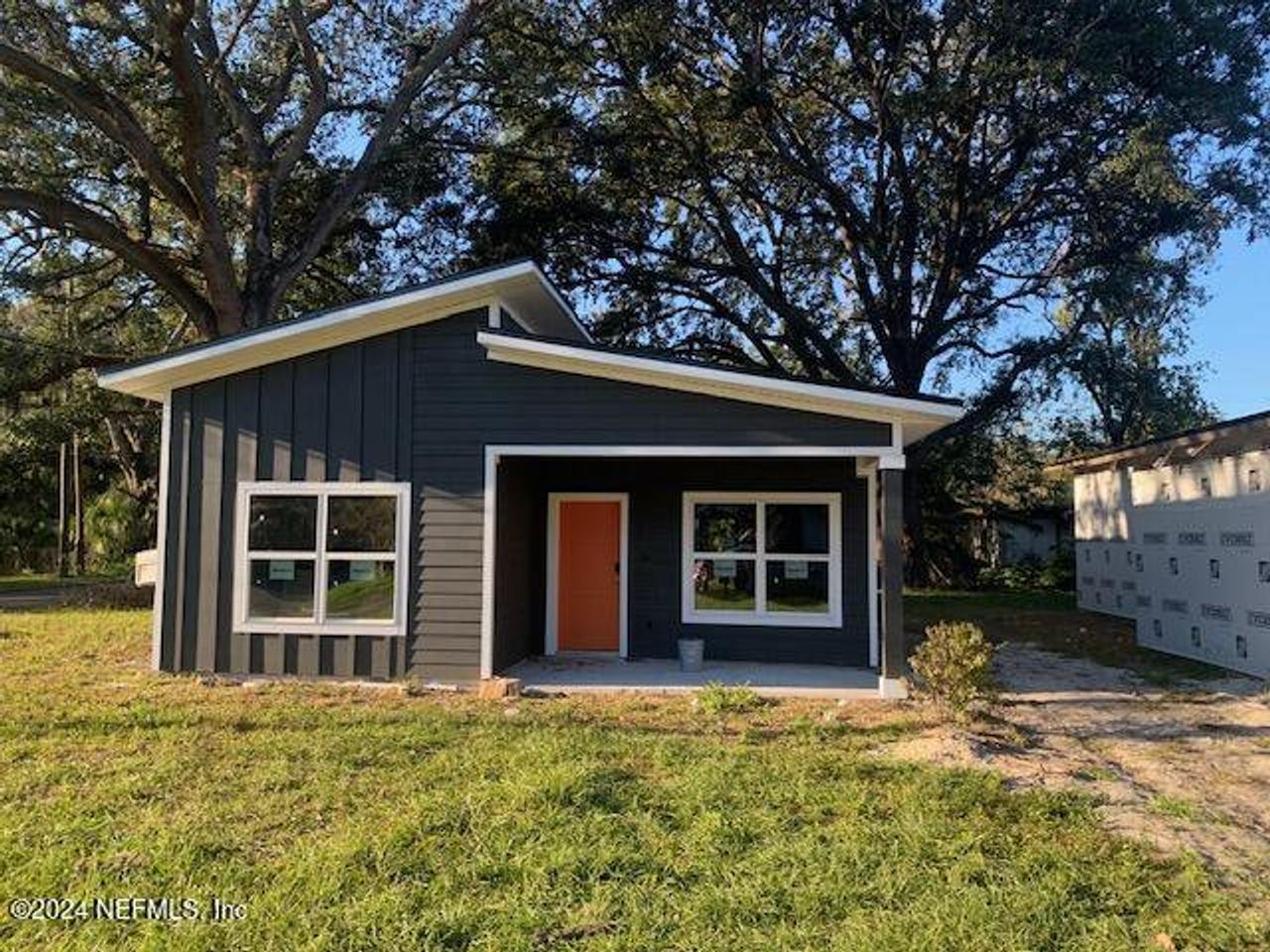 Front exterior of a new home in , Jacksonville, FL, highlighting curb appeal (Image 2).