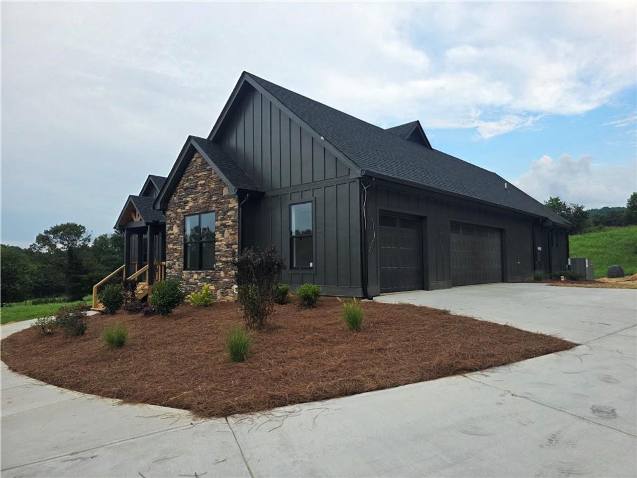 Front exterior of a new home in , Morganton, GA, highlighting curb appeal (Image 2). Front exterior of a new home in , Morganton, GA, highlighting curb appeal (Image 2).